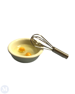 Egg and Whisk In A Bowl
